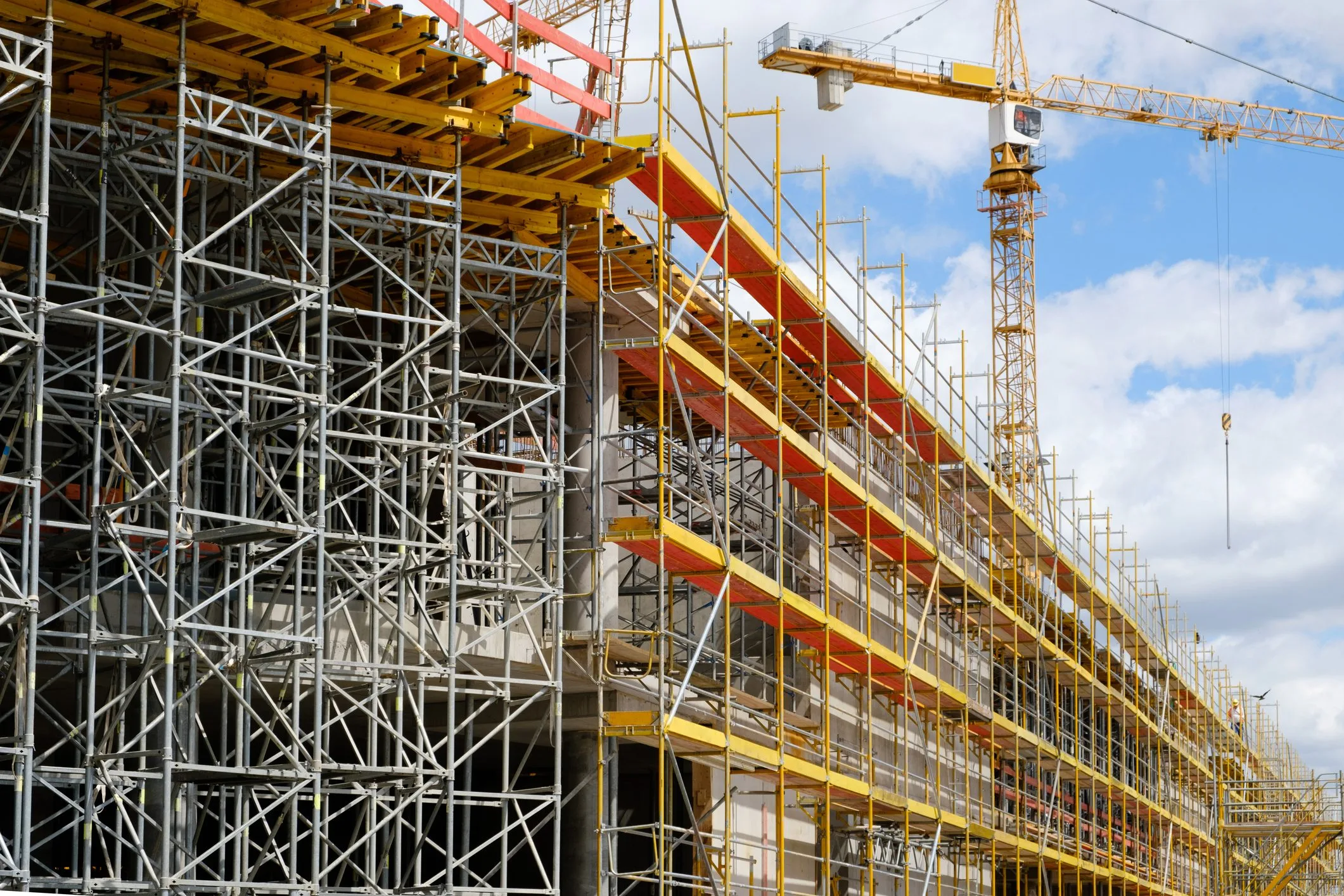 new building construction site,  scaffolding and crane on building site