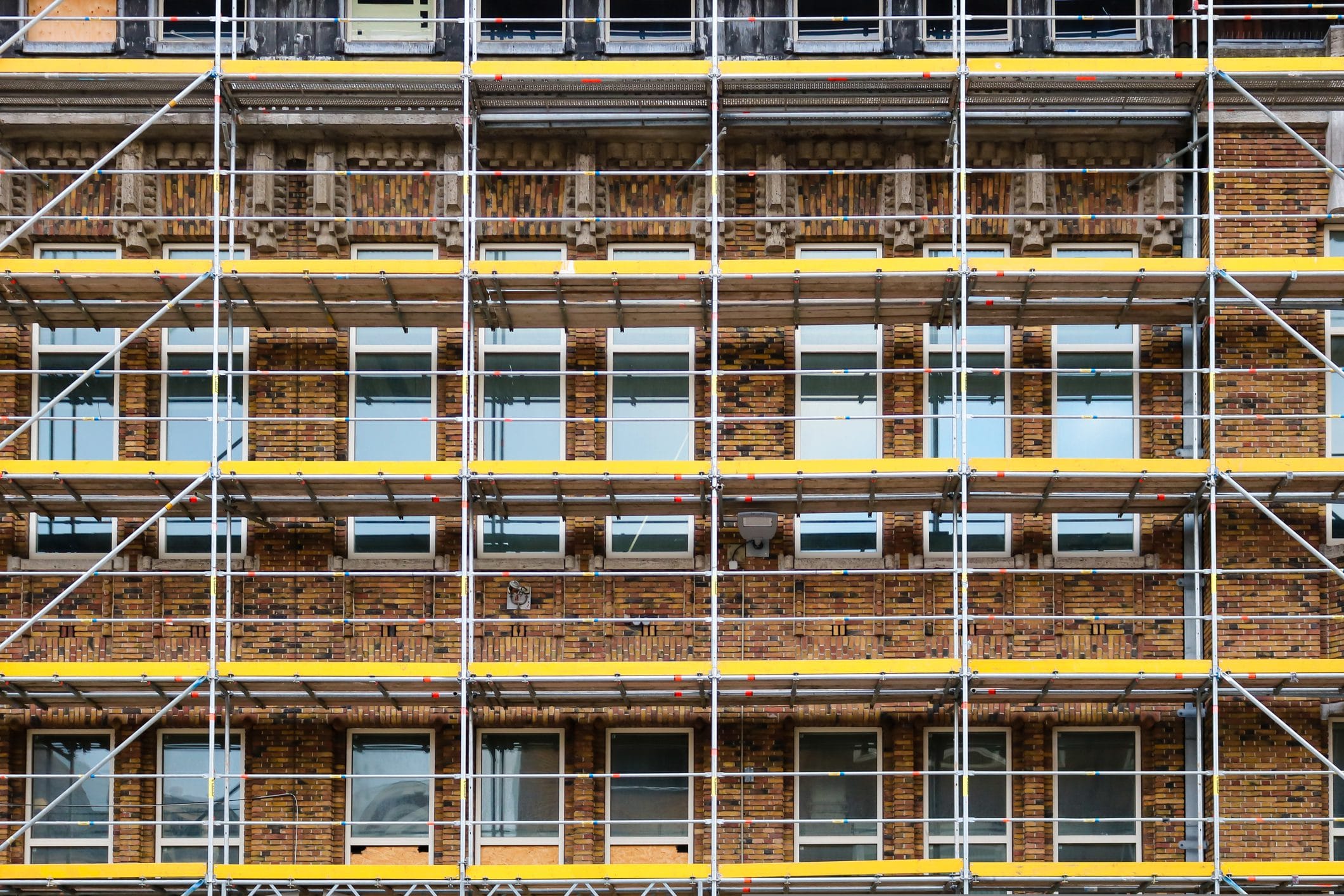 Scaffolding for renovation works on brick building Scaffolding for renovation works on brick building